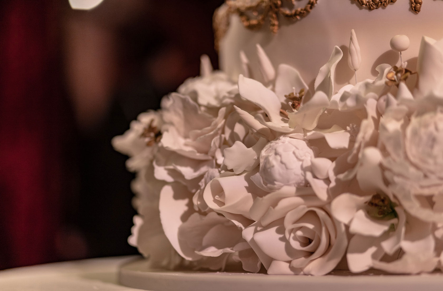 detailed white icing flowers on a wedding cake