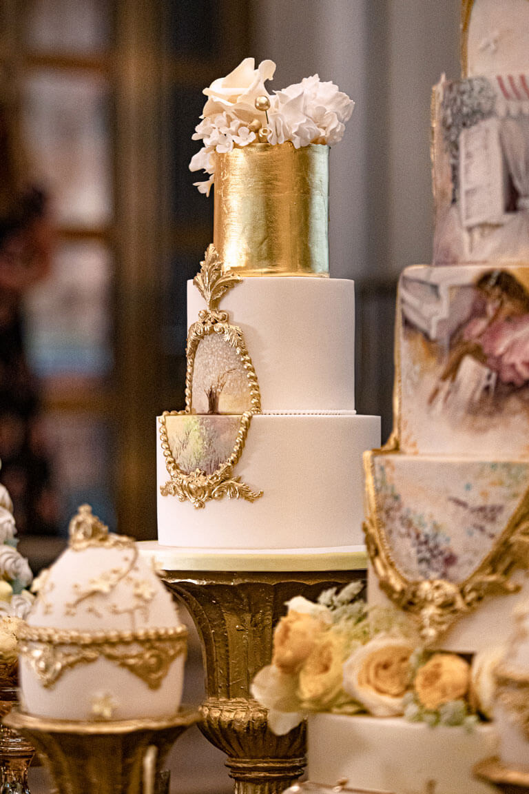 luxury hand painted gold and white tall wedding cakes
