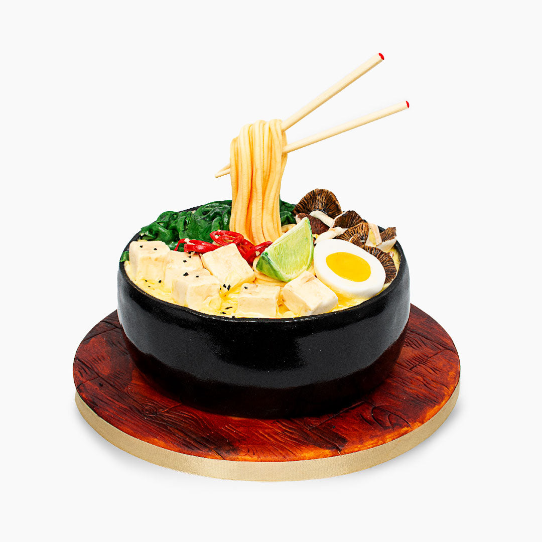 Delicious Ramen cake consisting of mushrooms, eggs, noddles & tofu - all made out of a flavourful light & moist sponge cake. This hyper-realistic cake makes for a lovely dinner dessert! Keep the chopsticks as a souvenir!