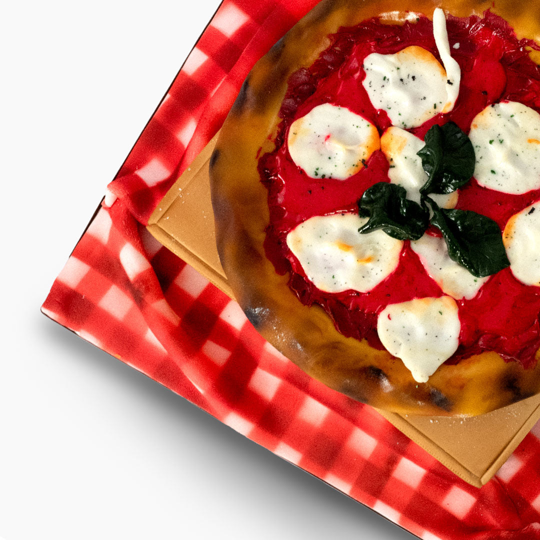 A pizza cake no other. Delicious golden crust with edible cheese and mozzarella toppings, even the pizza box is cake