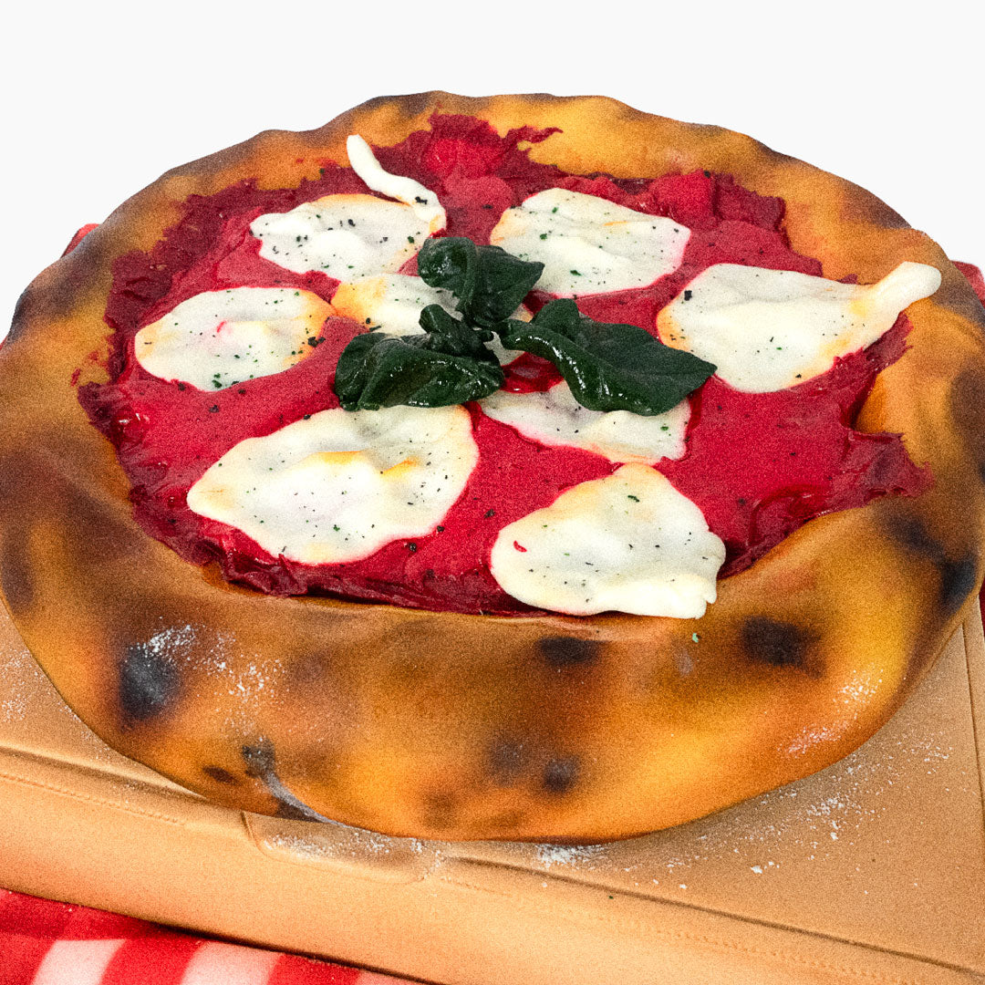 A pizza cake no other. Delicious golden crust with edible cheese and mozzarella toppings, even the pizza box is cake
