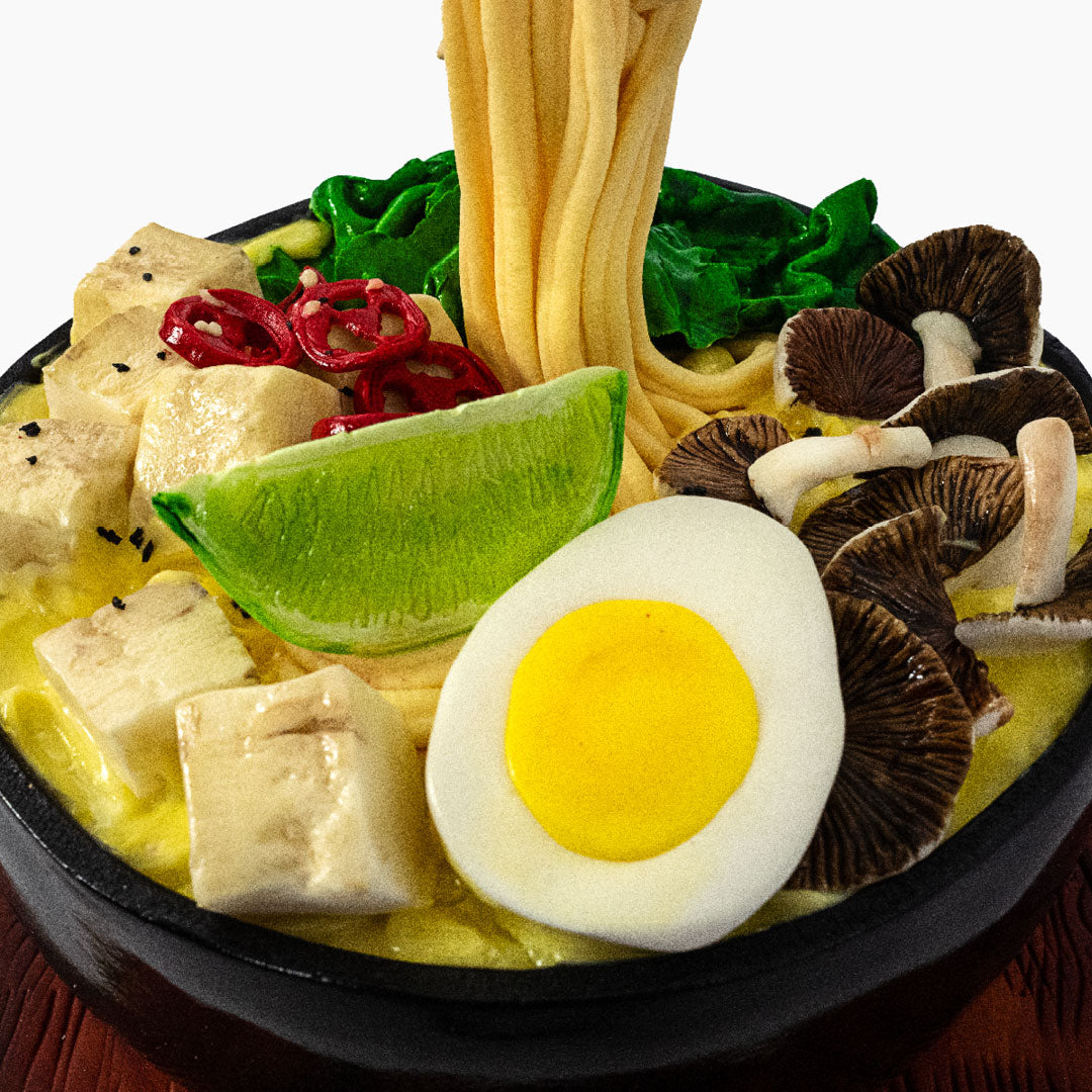 Delicious Ramen cake consisting of mushrooms, eggs, noddles & tofu - all made out of a flavourful light & moist sponge cake. This hyper-realistic cake makes for a lovely dinner dessert! Keep the chopsticks as a souvenir!