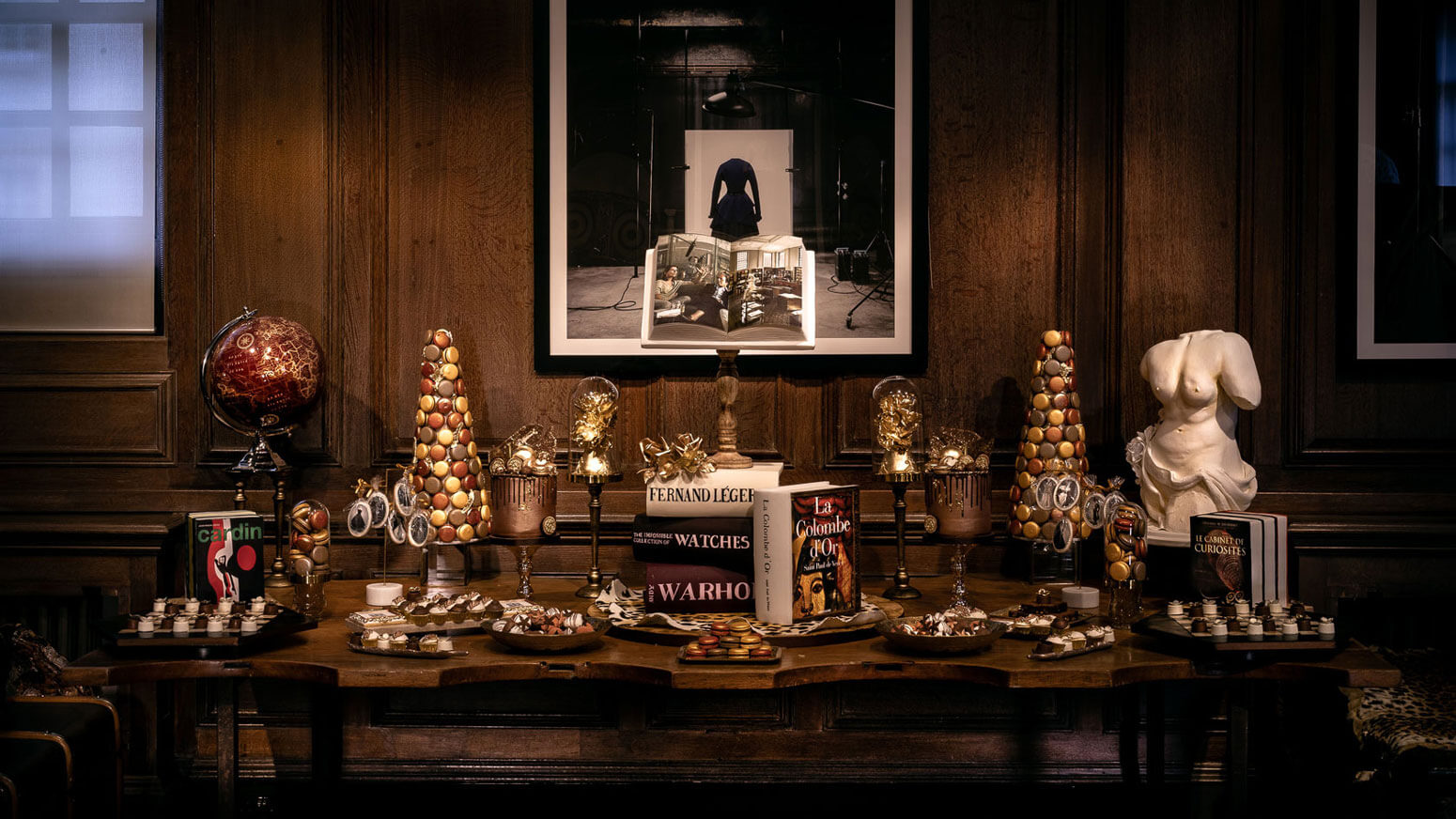 a table of desserts in unique shapes at an event in maison assouline