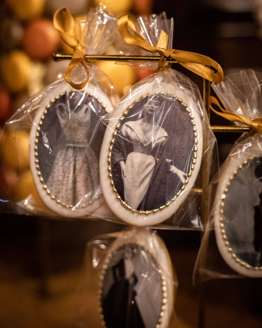 old fashioned black and white picture design on oval shaped cookies wrapped and tied with a bow