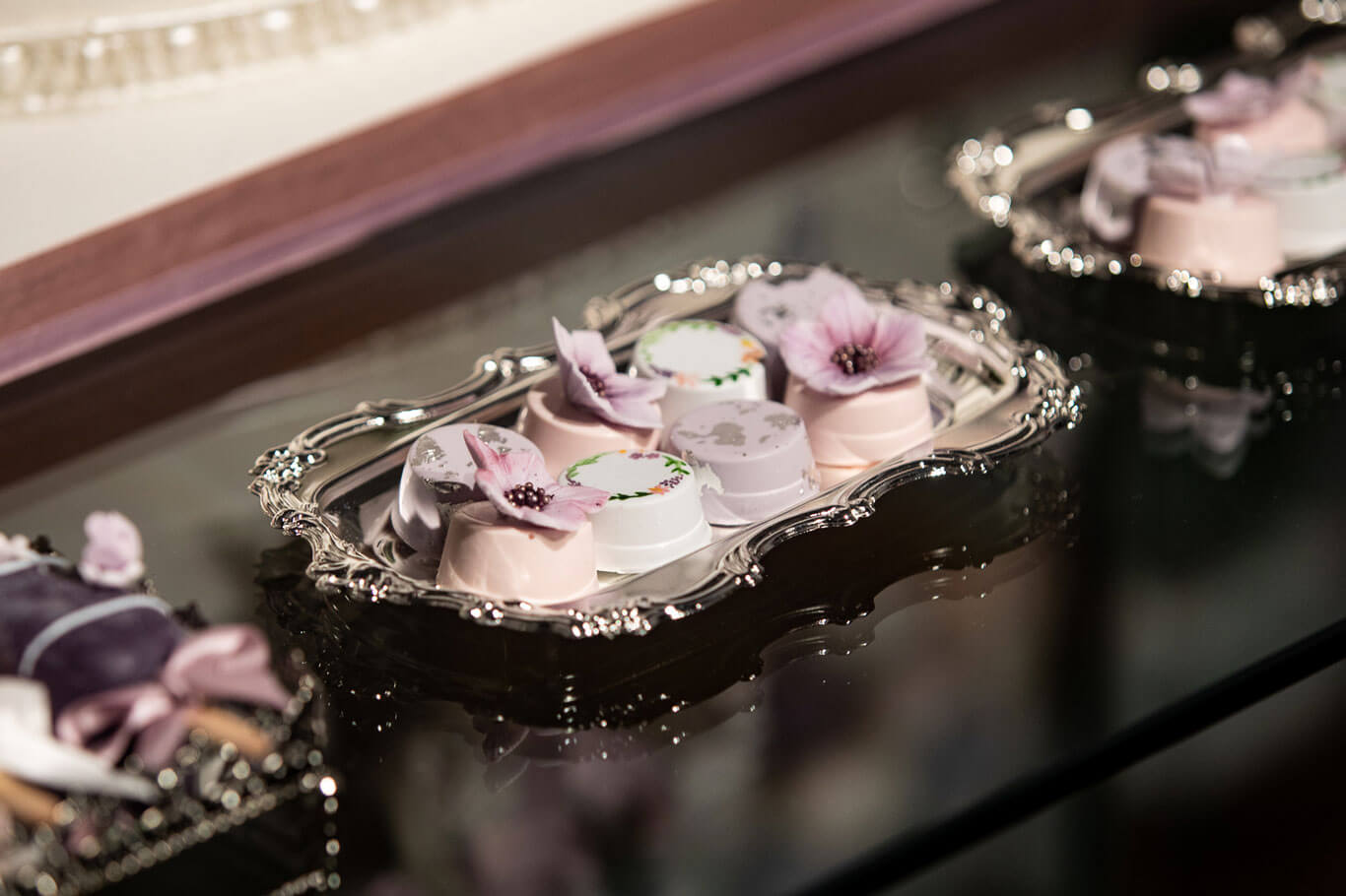 luxury mini oreo cookies and other sweet desert displayed on silver salvers for a wedding