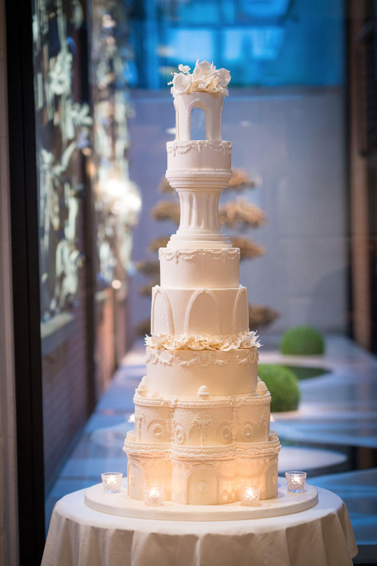 tall luxury detailed ivory iced wedding cake at the connaught hotel