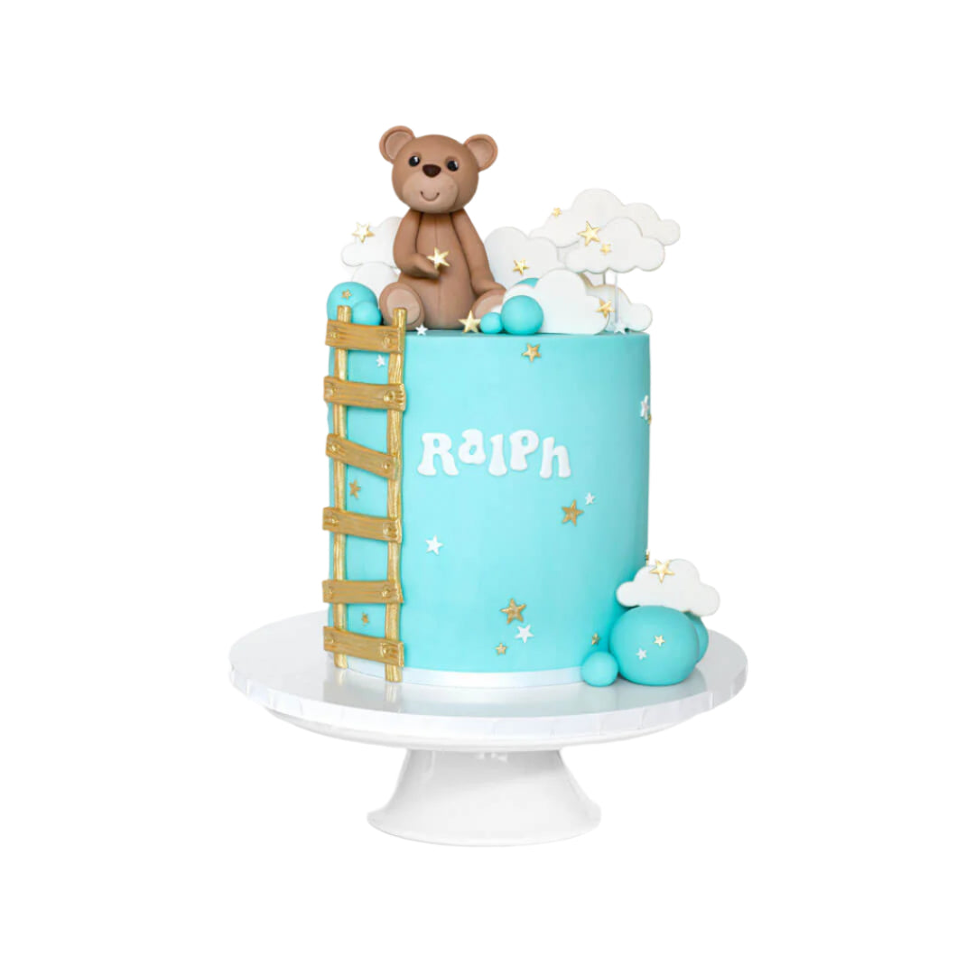 Teddy bear cake with gold ladder and clouds and stars decorations