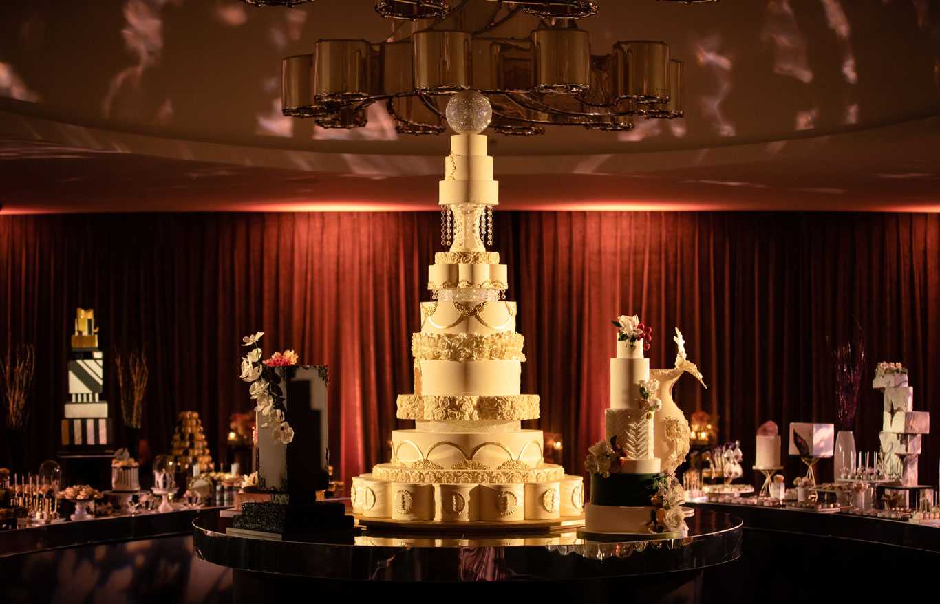 an enormous luxury 16 tiered white wedding cake