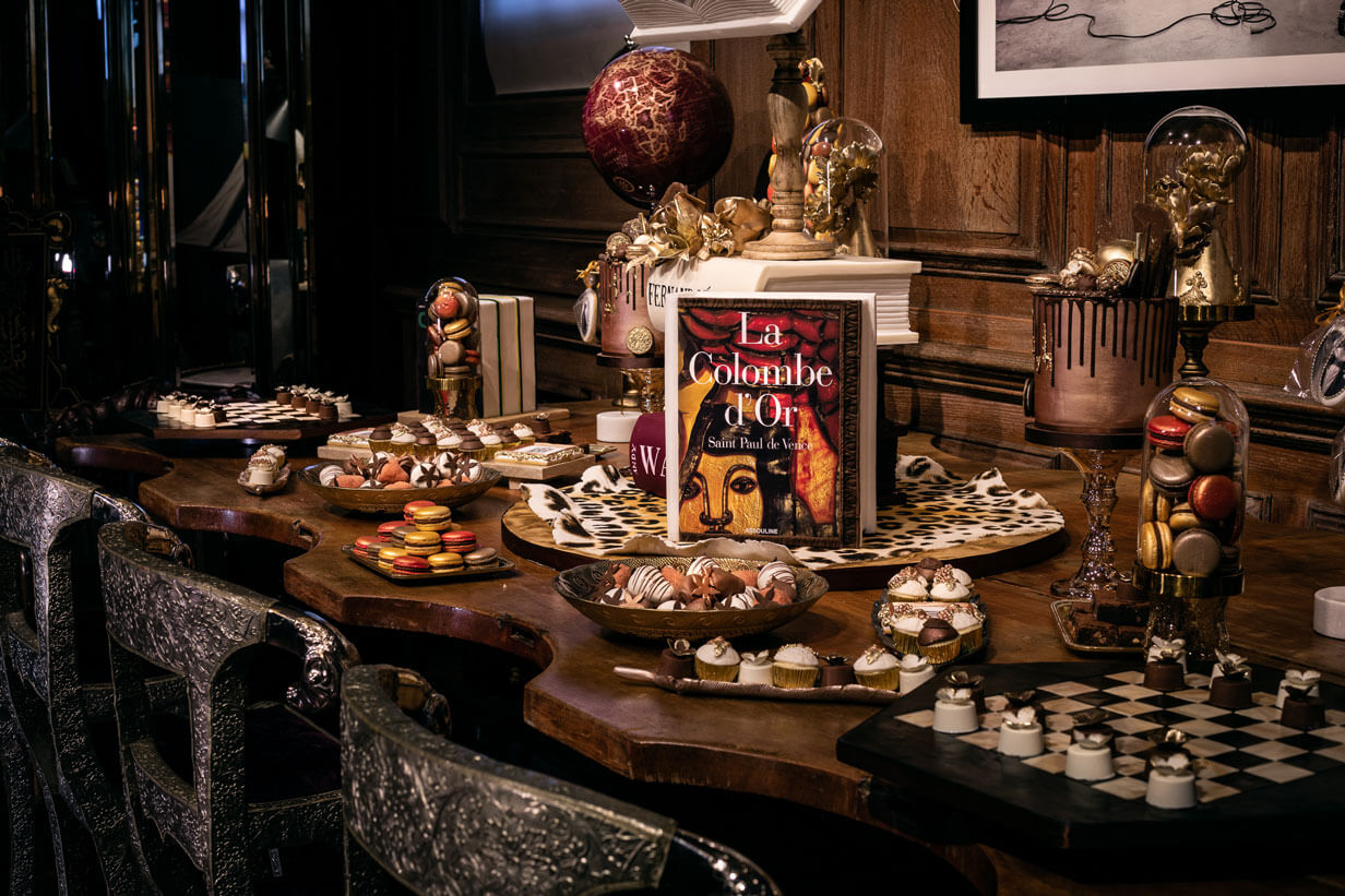 desert bar including a book made of cake at an event in an high end book store