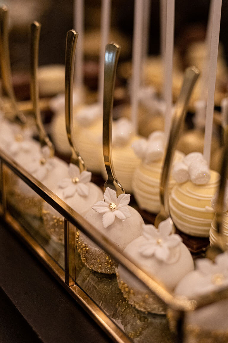 luxury white and gold cake pops flower design with fork as stick handle at private event london
