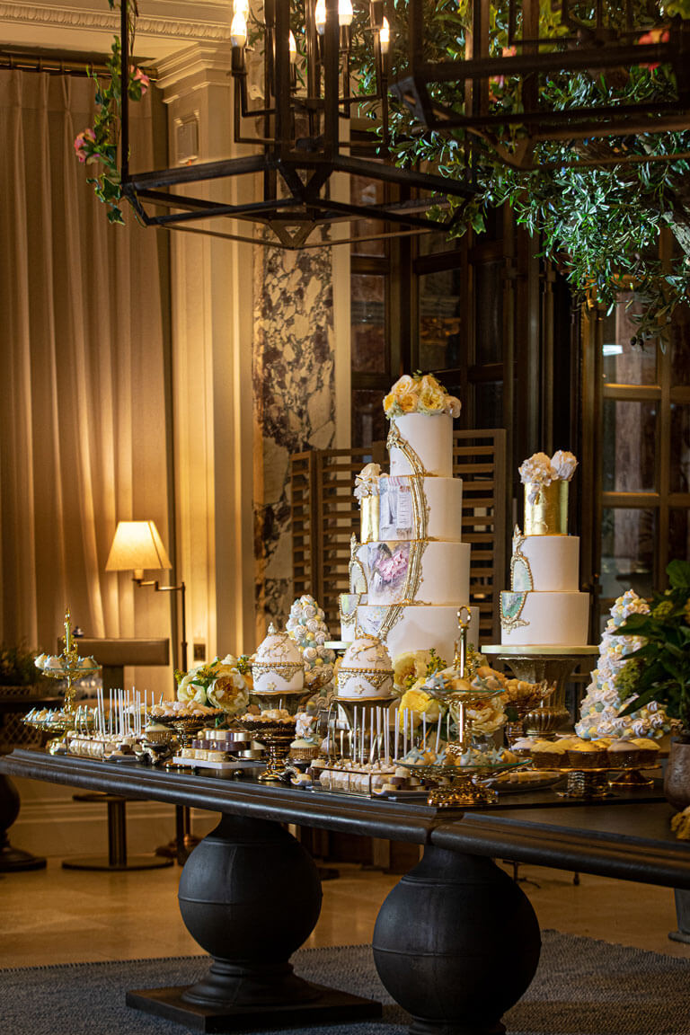 an array of indulgent sweets and cakes on a table at the kimpton fitzroy hotel for a private event