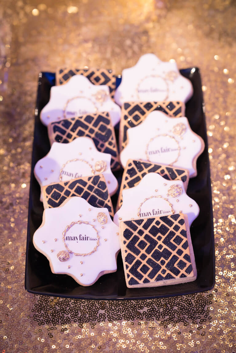 luxury art deco cookies with mayfair times logo in black and gold