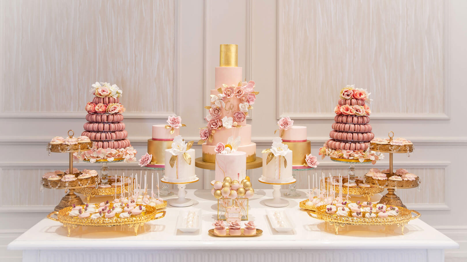 a blush pink dessert station in a modern 5 star hotel ballroom