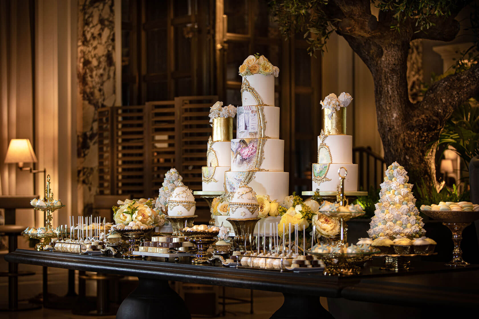 a bespoke display of indulgent sweets and deserts on a table for an event at the kimpton fitzroy hotel