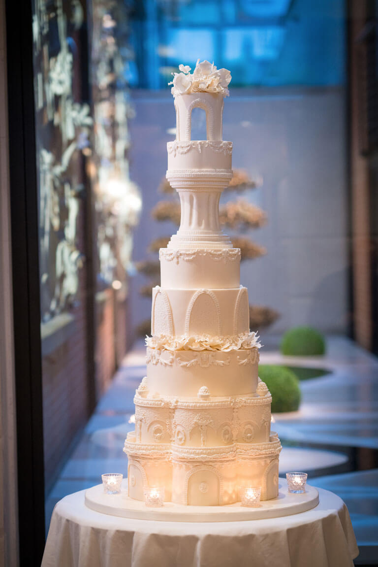 tall luxury detailed ivory iced wedding cake at the connaught hotel 