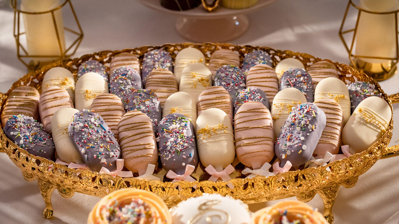 large display of cake lollies in a gold tray