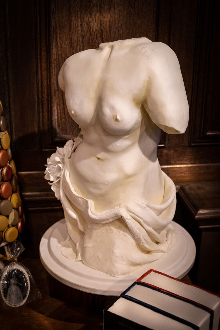 a human body statue made out of cake at a private event in london
