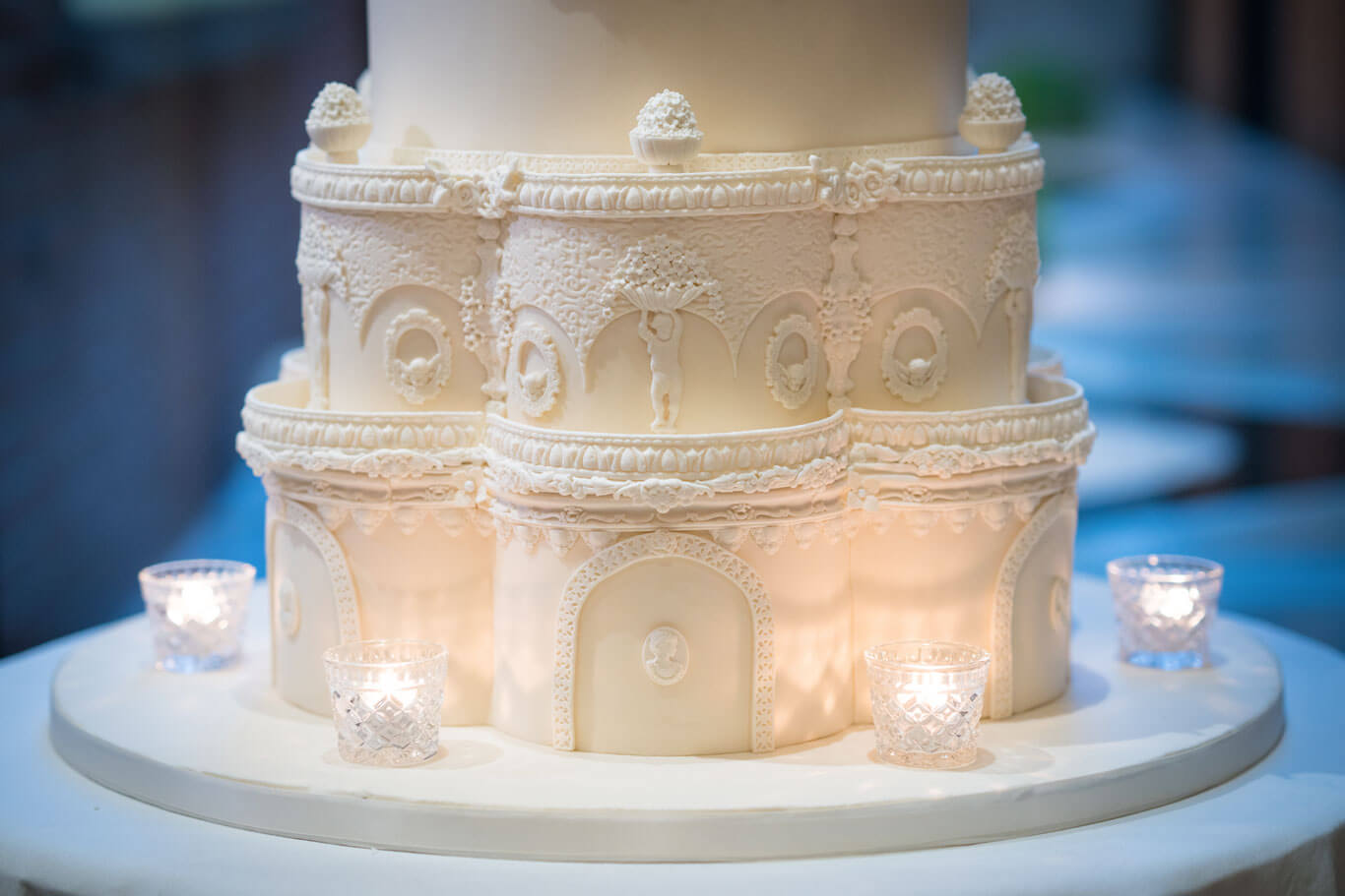 close up details of intricate icing on the base of a bespoke wedding cake