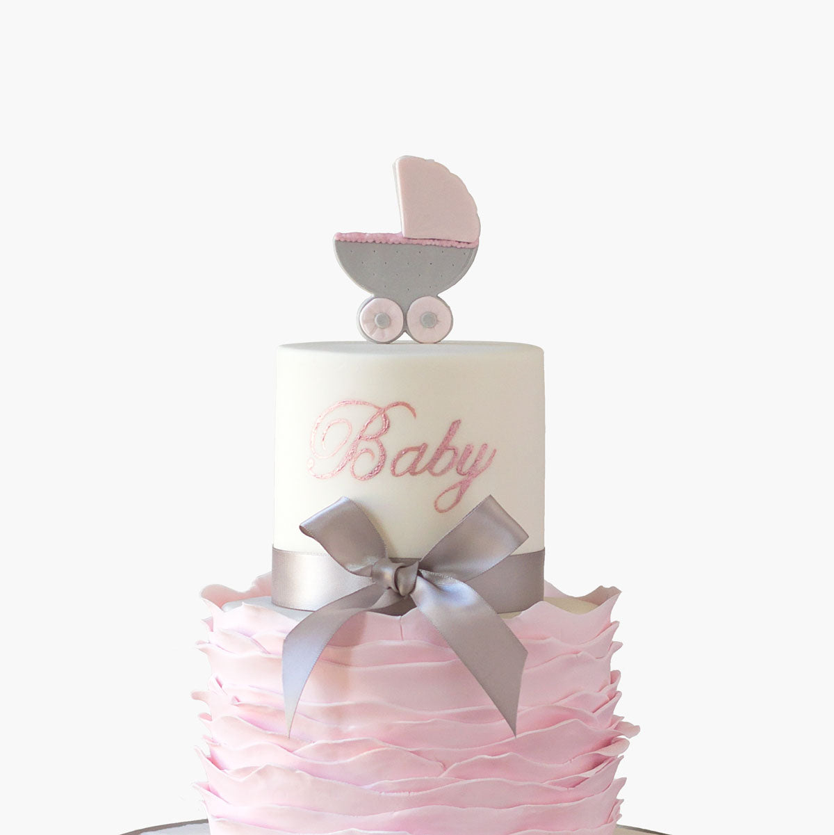 Two tier baby shower cake with delicate pushchair topper and fondant ruffles base and personalised name