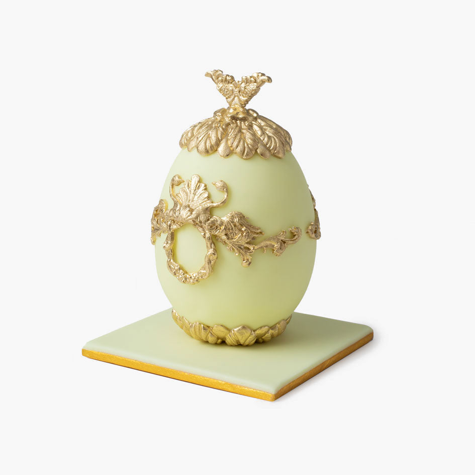 Lemon Faberge cake egg with ornate gold decorations and crown