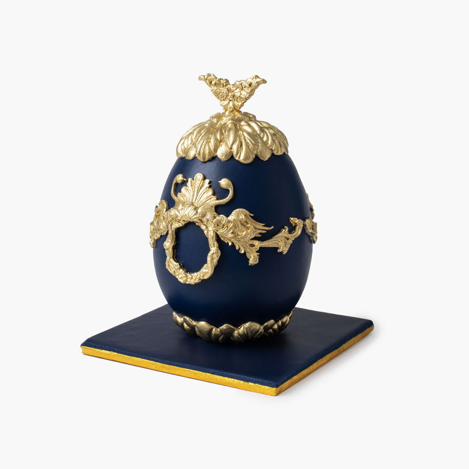 Navy Faberge cake egg with ornate gold decorations and crown